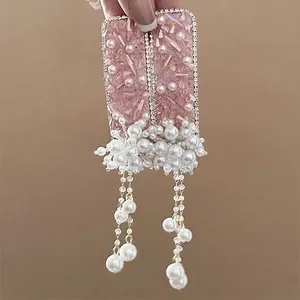 Pink sequin hair clips with white pearls and long fringe tassels for luxury styling