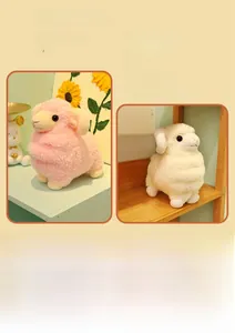 Close-up of pink and cream plush sheep toys with curly fleece and soft texture
