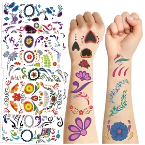 Detail of colorful Day of the Dead temporary tattoos with skull and floral patterns