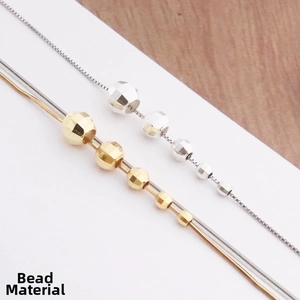 Detailed view of faceted gold and silver S925 sterling silver beads for DIY jewelry