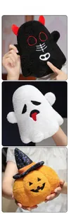 Detailed view of Halloween plush toys including a black demon, white ghost, and orange pumpkin