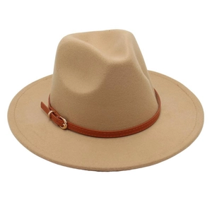 Close-up of camel wool felt fedora with brown leather strap and gold buckle detail