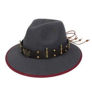 Detail of grey felt hat with leather band, eagle crest and red brim edge trim