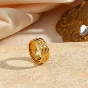 18K gold plated stainless steel triple-layered ring set with three small cubic zirconia