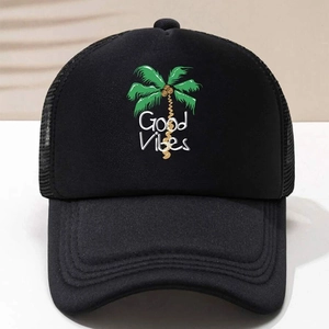 Close-up of black trucker hat with green coconut tree print and Good Vibes text