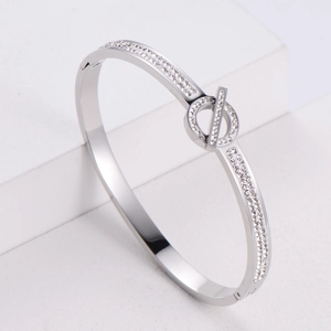 Silver planetary letter Q buckle bracelet with paved crystals on a minimalist band
