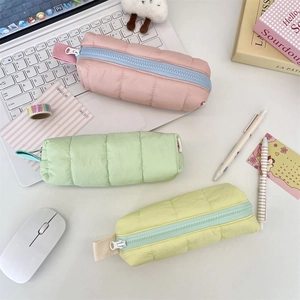 Quilted nylon pencil case set in pink, mint, and yellow with smooth zipper closure