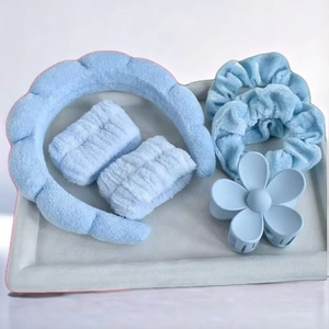 Light blue 5-piece spa set with sponge headband, wristbands, scrunchies and flower hair claw