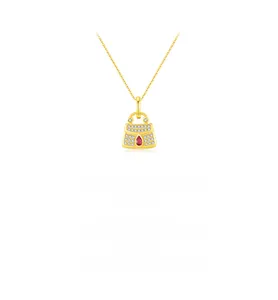 Macro shot of s925 silver bag pendant featuring pave zircons and a ruby teardrop