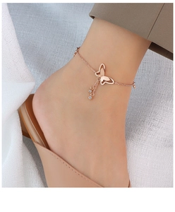 Detailed macro view of 18k gold plated titanium steel butterfly anklet with rhinestones