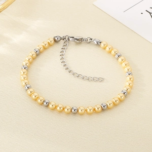 Close-up of yellow pearls and silver beads bracelet with adjustable lobster clasp