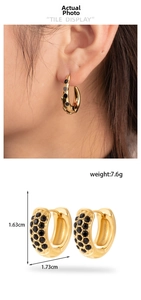 Macro shot of gold-plated hoop earrings with black zircon inlay and size dimensions