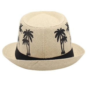 Close-up of coconut tree embroidery on a beige straw fedora with a black ribbon