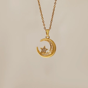 Detailed view of the gold-plated moon and star pendant necklace with micro-set zircon crystals