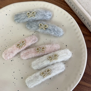 Set of 6 plush bow hair clips with rhinestone accents in grey, pink, and beige colors