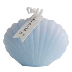 Light blue shell shaped aromatherapy candle with Save the Date tag on white background