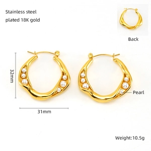 Detail view of 18K gold plated stainless steel hoop earrings with pearl size 31mm x 32mm