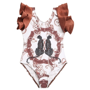 Girls' one-piece swimsuit featuring red ruffle straps and leopard chain print on white