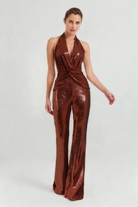 Close-up of bronze sequin halter neck jumpsuit with a plunging deep V-neckline and waist twist