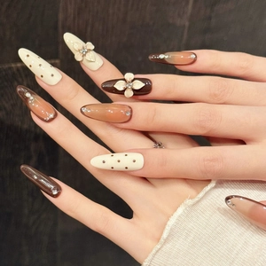 Caramel Leopard cat eye press-on nails with 3D floral relief and rhinestones