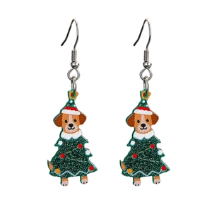 Detailed view of acrylic Christmas tree earrings with cute puppy wearing a Santa hat