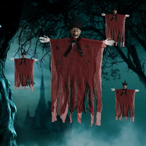 Macro detail of Halloween hanging ghost with red tattered robe and skull hands in foggy woods