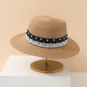 Flat top straw sun hat with pearl and sequin band on a professional display stand