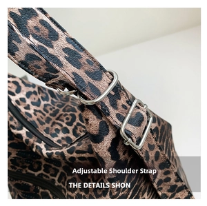 Detailed view of leopard print tote bag with adjustable shoulder strap and metal buckle