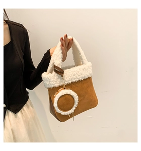 Detail of plush tote bag in brown faux suede with white lamb wool trim and coin purse