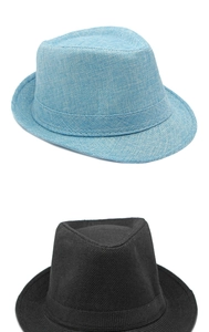 Detail view of woven texture and decorative band on sun hats in light blue and black colors