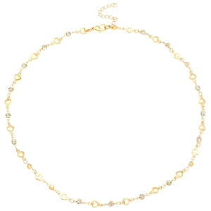 Macro detail of Y-shaped gold necklace chain with hollow hearts and rhinestones