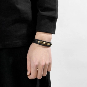 Multilayer black woven leather bracelet for men featuring elegant gold metal fasteners