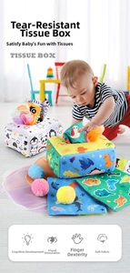 Close-up of baby interacting with dinosaur theme sensory tissue box and plush balls