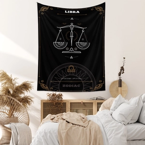 Detail of Libra zodiac tapestry featuring gold accents and minimalist bohemian bedroom decor