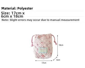 Pink quilted drawstring camera bag with bear pattern and dimensions 18x17x6 cm