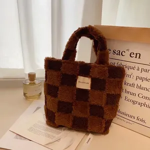 Close-up of checkered lamb wool bucket bag with woven texture and premium white fabric label