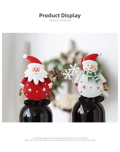 Detail of Santa Claus and Snowman wine bottle toppers with small decorative metal bells