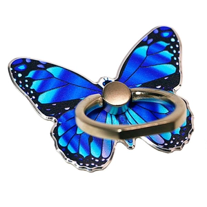 Detailed view of the blue butterfly phone ring holder with champagne gold metal grip
