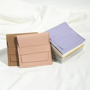 Detailed view of envelope-style PU leather jewelry pouches in Morandi colors with snap closure