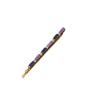 Elegant gold hair clip featuring alternating purple and blue rectangular gemstones