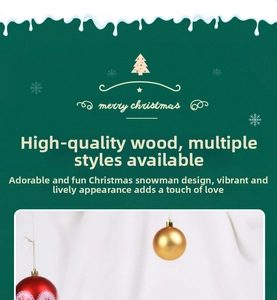 Macro shot of wooden Christmas sleigh decoration with red and gold baubles and snow details