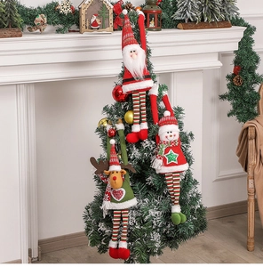 Detailed view of plush Santa, Snowman, and Reindeer hanging ornaments on a Christmas tree