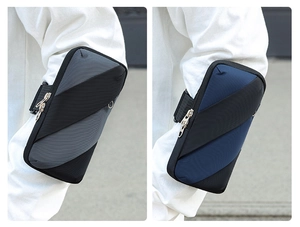 Detail view of breathable sport armbands in grey and dark blue for running and cycling