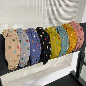 Detailed row of assorted color knotted headbands with sparkling crystal rhinestones