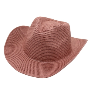 Panama straw cowboy sun hat in dark pink woven texture with classic wide upturned brim