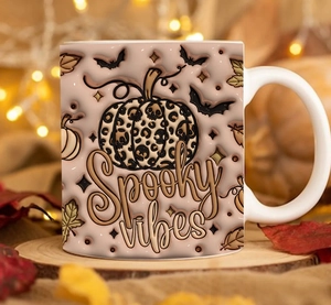 Close-up of Halloween ceramic mug with pumpkin, leopard print and Spooky Vibes text