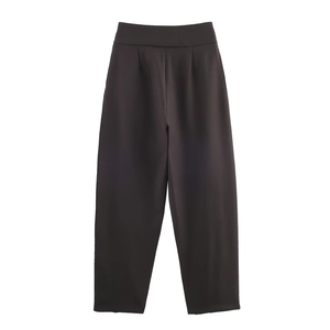 Detailed view of high-waisted black casual suit trousers with premium drape and sharp texture