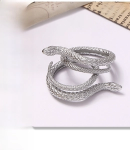 Detailed close-up of double-layer silver snake ring featuring intricate scale textures