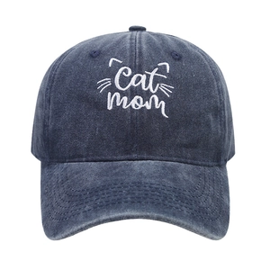 Washed navy cotton baseball cap with white Cat Mom embroidery and cat whiskers design