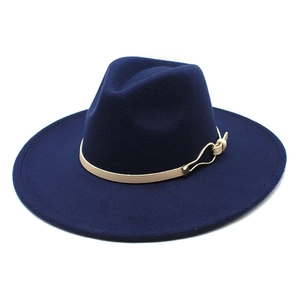 Detailed close-up of navy wool fedora with brown leather band and gold buckle detail